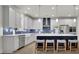 Modern kitchen with white cabinets, stainless steel appliances, and a large island with seating at 783 Phil Haven Ln, Kennesaw, GA 30152