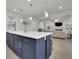 Kitchen island boasts plenty of storage space and a white countertop overlooking the living area at 783 Phil Haven Ln, Kennesaw, GA 30152