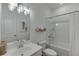 Bright bathroom features a tub shower with white tile surround and a modern vanity sink at 1726 Gunnin Nw Trce # 231, Atlanta, GA 30318