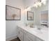 Elegant bathroom with double vanity, large mirror, and stylish lighting fixtures at 1726 Gunnin Nw Trce # 231, Atlanta, GA 30318