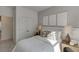 Comfortable bedroom featuring a bed, nightstands, and ensuite bathroom access at 1726 Gunnin Nw Trce # 231, Atlanta, GA 30318