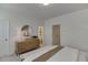 Bright bedroom featuring a dresser, ensuite bathroom, and comfortable bed at 1726 Gunnin Nw Trce # 231, Atlanta, GA 30318