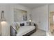 Cozy bedroom with decorative pillows, modern art, and bright closet space at 1726 Gunnin Nw Trce # 231, Atlanta, GA 30318