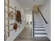 Inviting foyer showcasing a custom coat rack and staircase to the upper level at 1726 Gunnin Nw Trce # 231, Atlanta, GA 30318