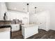 Stylish kitchen boasting white cabinetry, subway tile backsplash, and a center island at 1726 Gunnin Nw Trce # 231, Atlanta, GA 30318