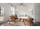 Comfortable living room featuring stylish seating, decorative paneling, and a ceiling fan at 1726 Gunnin Nw Trce # 231, Atlanta, GA 30318