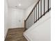 Staircase leading to the upper level with a white door in the background at 1726 Gunnin Nw Trce # 231, Atlanta, GA 30318