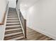 Staircase with hardwood steps and metal railing at 1726 Gunnin Nw Trce # 231, Atlanta, GA 30318