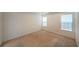 Spacious bedroom features plush neutral carpeting, bright double windows, and ample natural light at 2374 Brandenberry Ct, Decatur, GA 30034
