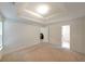 Open bedroom features carpeted floor, recessed ceiling, and bright double windows with generous natural light at 2374 Brandenberry Ct, Decatur, GA 30034