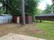 Spacious backyard with storage shed, mature trees, and partial fencing at 4925 Sugar Valley Sw Rd, Mableton, GA 30126