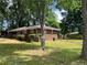 Charming brick home with a well-maintained front yard and mature trees at 4925 Sugar Valley Sw Rd, Mableton, GA 30126