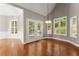 Bright dining area with hardwood floors and French doors leading to the backyard at 7615 Abbey Glen Dr, Cumming, GA 30028