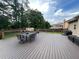 Beautiful backyard with patio furniture, ideal for outdoor dining and relaxation at 1128 Carillon Dr, Conyers, GA 30013