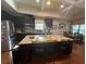 A full kitchen view with stainless steel appliances, granite countertops, a large kitchen island, and a breakfast nook at 1128 Carillon Dr, Conyers, GA 30013