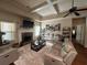 Comfortable living room features a fireplace, tray ceiling, and plush seating at 1128 Carillon Dr, Conyers, GA 30013
