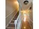 Inviting hallway with hardwood floors and staircase leading to the upper level, bathed in natural light at 2872 Bentwood Dr, Marietta, GA 30062
