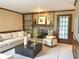 Cozy living room featuring a brick fireplace, built-in bookshelves, and comfortable seating at 2872 Bentwood Dr, Marietta, GA 30062