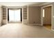 Bright living room showcasing built-in cabinets and a large window, perfect for comfortable living and entertaining at 2872 Bentwood Dr, Marietta, GA 30062