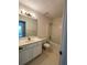 Bright bathroom featuring a vanity with mirror and a shower-tub combination at 2915 Camelot Woods Dr, Lawrenceville, GA 30044