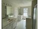 Bright bathroom featuring double sinks, bathtub and walk-in shower at 2915 Camelot Woods Dr, Lawrenceville, GA 30044