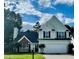 Charming two-story home featuring a well-manicured lawn, attached two-car garage, and inviting front door at 2915 Camelot Woods Dr, Lawrenceville, GA 30044