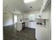 Bright kitchen with white cabinetry, stainless steel appliances, and an eat-in area at 2915 Camelot Woods Dr, Lawrenceville, GA 30044