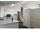 Open kitchen with white cabinetry, modern appliances, and a breakfast bar perfect for casual dining at 2915 Camelot Woods Dr, Lawrenceville, GA 30044