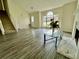 Bright living room boasts wood floors, a fireplace, and a large window providing natural light at 2915 Camelot Woods Dr, Lawrenceville, GA 30044