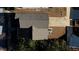 Overhead view of a home with asphalt shingle roof and a concrete driveway surrounded by natural landscape at 5114 Arnold St, Covington, GA 30014
