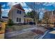 Inviting two-story home with a covered front porch, well-kept lawn, and complemented by mature trees and landscaping at 5114 Arnold St, Covington, GA 30014