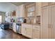 Kitchen with stainless steel appliances, dark wood floors, granite countertops, and white cabinets at 5114 Arnold St, Covington, GA 30014