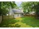 A large fenced backyard featuring a well-maintained lawn and mature trees for plenty of shade at 6 Stonebridge Se Ct, Cartersville, GA 30121