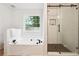 Bathroom featuring a garden tub and a glass enclosed shower at 6 Stonebridge Se Ct, Cartersville, GA 30121