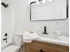 Bathroom with light wood vanity, quartz countertop and integrated sink and shower/tub combo at 6 Stonebridge Se Ct, Cartersville, GA 30121