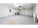 Spacious garage with a concrete floor, ample lighting, and a large overhead door at 6 Stonebridge Se Ct, Cartersville, GA 30121