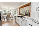 Modern kitchen with white cabinets, stainless appliances, and open view to the dining area at 6 Stonebridge Se Ct, Cartersville, GA 30121
