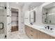 Well-lit bathroom featuring a double vanity, marble floors and glass shower at 105 Georgia Se Ave # 4, Atlanta, GA 30312