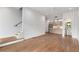 Open-concept living room with hardwood floors flowing into a modern kitchen area at 105 Georgia Se Ave # 4, Atlanta, GA 30312