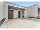 This outdoor patio features stone-look tiling, gray walls, and integrated benches for seating at 105 Georgia Se Ave # 4, Atlanta, GA 30312