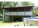 Inviting screened back porch providing a serene outdoor space for relaxing and enjoying the view at 259 Gramling Trl, Canton, GA 30114