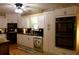 Modern kitchen with white cabinets, black counters, and stainless appliances at 259 Gramling Trl, Canton, GA 30114