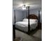 Bedroom featuring a four post bed with wood frame and soft carpet at 259 Gramling Trl, Canton, GA 30114