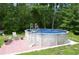 Outdoor above ground pool with patio, perfect for summer entertaining at 259 Gramling Trl, Canton, GA 30114