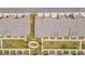 An aerial view shows a community with well-manicured lawns, sidewalks, and attractive townhome-style residences at 3195 Bartee Walk, Suwanee, GA 30024