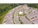 Aerial view of a beautiful neighborhood featuring a community pool with lounge chairs and mature landscaping at 3195 Bartee Walk, Suwanee, GA 30024