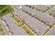 Aerial view of new townhome construction in a neighborhood with a pond and many trees at 3195 Bartee Walk, Suwanee, GA 30024