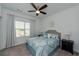 Cozy bedroom featuring a patterned bedspread, nightstands, and a ceiling fan for comfort at 3195 Bartee Walk, Suwanee, GA 30024