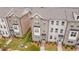 A row of beautiful townhomes, boasting well-manicured lawns and lovely landscaping at 3195 Bartee Walk, Suwanee, GA 30024