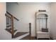 Foyer with hardwood floors, staircase, and charming entryway storage at 3195 Bartee Walk, Suwanee, GA 30024
